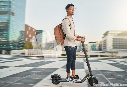 Image of Travel, scooter and student in city, street or outdoors on road on eco friendly transportation. Technology, sustainability and male from India on electric moped commuting to college or university.