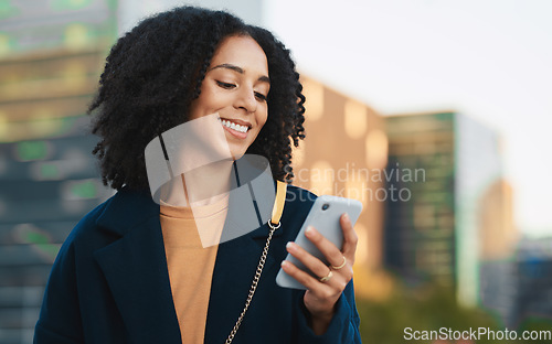 Image of Business woman, phone and typing in city, street or outdoors on social media, text message or web browsing. Mobile, tech and black female scrolling app on 5g smartphone, networking or texting in town