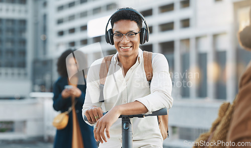 Image of Music, electric scooter and city with a black man on his commute to work or business in the morning. Portrait, headphones and transport with a male employee commuting or working in an urban town