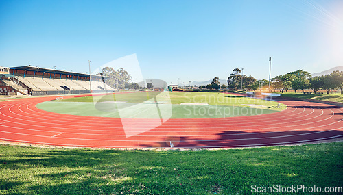 Image of Empty running track, arena or stadium architecture for marathon race, sports cardio training or fitness workout. Blue sky, olympic course and event field for athletics contest, competition or games