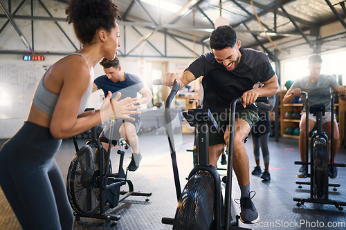 Image of Cycle spinning, fitness and applause of a coach with motivation for cycling gym training. Sports coach clapping for workout, wellness and bike exercise success of people on bicycle happy from cardio