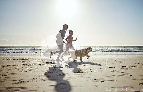 Image of Couple, beach and running with dog for health, wellness or exercise. Mock up, diversity and man, woman and animal outdoors on sports run, exercising or workout jog on sandy seashore or ocean coast.