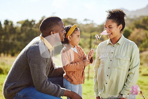 Image of Happy family, countryside fun and child with flower tickle moms nose, play or enjoy outdoor quality time together. Love, nature freedom and spring peace for kid girl, parents or bonding black family