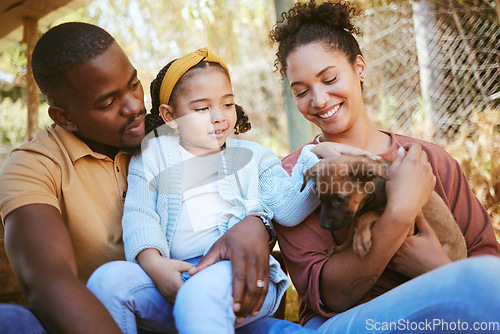 Image of Happy family, animal shelter and dog with girl and parents bond, relax and sharing moment of love, trust and care. Black family, animal rescue and puppy with family at shelter, playful, cute and joy