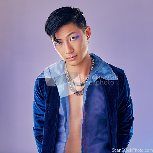 Image of Cyberpunk, makeup and Asian man with fashion for rock, metal identity and futuristic clothes. Freedom, cosmetics and portrait of a young creative rock model with luxury clothing and funky, cool style