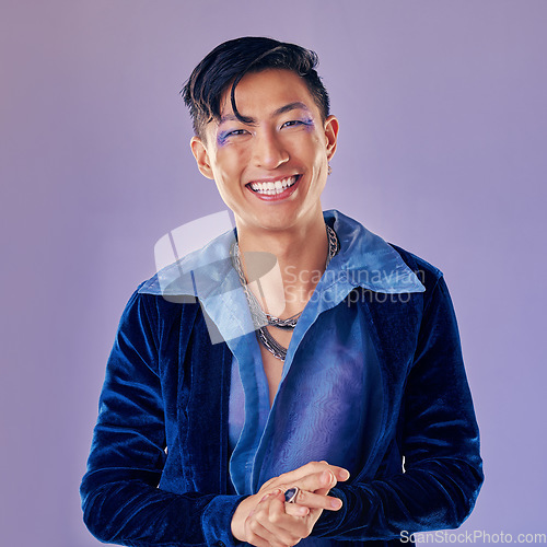 Image of Fashion, punk makeup and Asian man in studio isolated on a purple background. Beauty portrait, lgbtq and cyberpunk male model from Japan with lip cosmetics, jewelry ring or designer jacket outfit.