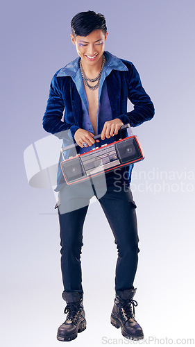 Image of Fashion, makeup and radio with an lgbt man model in studio on a purple background for gay pride or music. Style, trendy and transgender with an androgynous male listening to audio in fancy clothes