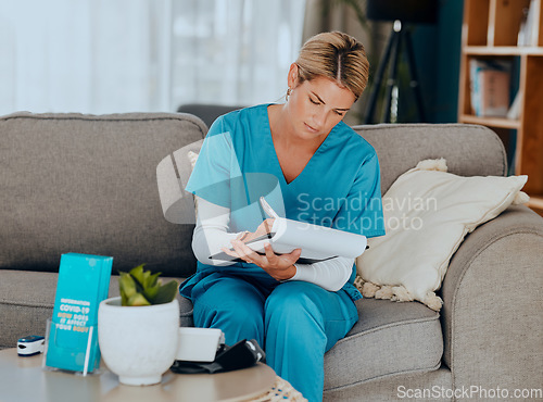 Image of Medical, sofa and nurse writing notes in living room at home care with insurance paperwork. Professional, work and healthcare professional doing analysis on nursing results, documents or information.