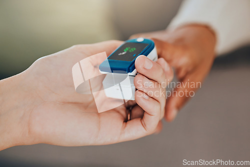 Image of Oximeter, test and hand of a doctor with a patient for healthcare, medical help and consulting in house. Digital, monitor and reading of health of oxygen in blood and check during a consultation