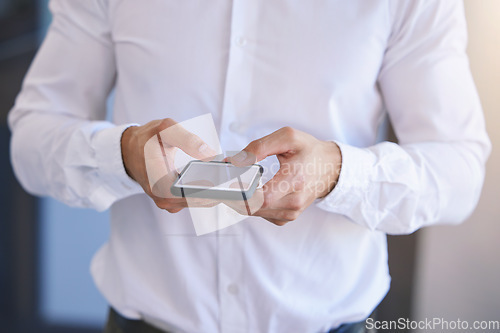 Image of Phone, communication and networking in the hands of a business man in the office for corporate work. Mobile, contact and social media with a smartphone in the hand of a professional working employee