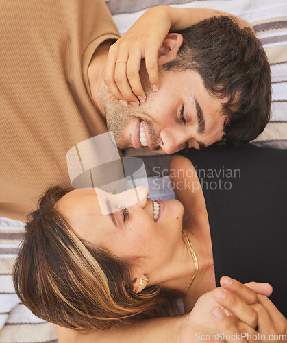 Image of Top view, love and couple looking happy, smile and together for bonding, romance or relationship. Romantic, man and woman being loving, happiness or intimacy for affection, dating or content to relax