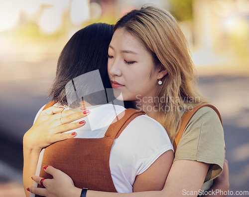 Image of Love, women and hug for connect, sad and support for understanding with problem, compassion and calm together. Asian woman, girl and embrace friend, loving and help to console in kind relationship