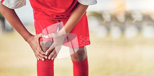 Image of Sport, knee injury and soccer player on field, fitness and athlete have pain with exercise and medical emergency. Soccer, accident in game and sports training, muscle ache and active lifestyle.