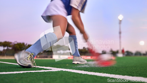 Image of Sports, hockey and hit with woman on field for training, fitness and goals exercise. Challenge, action or power with shoes of hockey player in stadium for competition, performance and athlete workout