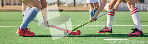 Image of Fitness, sports and hockey with women on field and training for competition, challenge and workout. Battle, games and exercise with shoes of hockey player and sticks in stadium for workout and health
