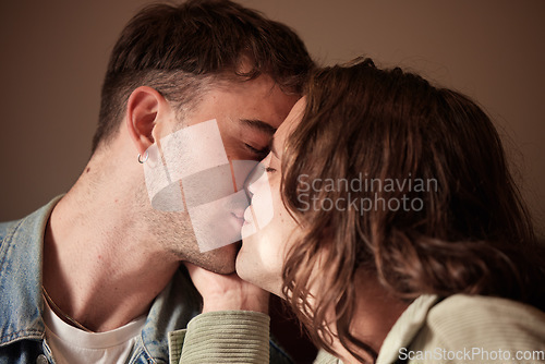 Image of Couple kiss, love or gay men for trust, romance or support in studio with brown background. Happy, relax or LGBT people kissing for homosexual care, happiness or marriage anniversary date