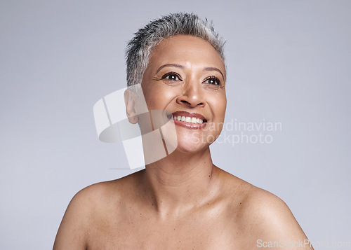 Image of Senior model, beauty and smile on face for makeup, cosmetics and skincare with vision in studio. Elderly black woman, cosmetic wellness and happy for skin glow, radiant and health by grey background
