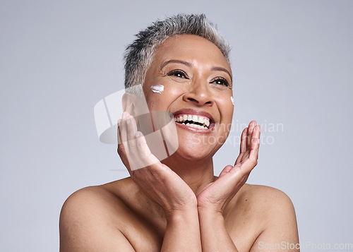 Image of Skincare, cream and senior black woman in studio with happy facial, makeup cleaning or sunscreen product for marketing mock up. Beauty, anti aging and face of old woman for dermatology or cosmetics