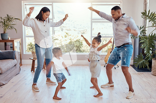 Image of Family, dance and house for freedom and carefree fun bonding while being playful, silly and goofy. Playing, mother and father dancer and dancing with children, brother and sister in family home