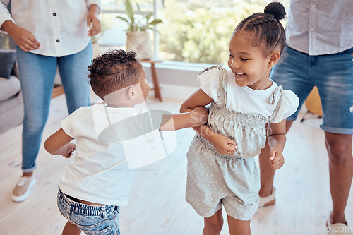 Image of Family, children and dancing together with energy, love and care of sister and brother for fun and home bonding. Dance, happiness and music with kids enjoying freedom and quality time in family home