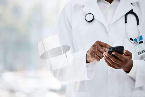 Image of Phone, hand and doctor browsing social media online using wifi in a medical hospital for research. Analysis, cellphone and typing text for contact in healthcare clinic with the hands of a gp