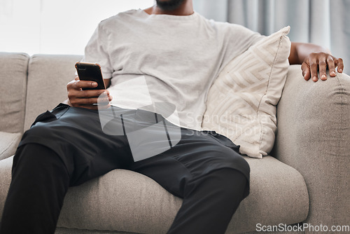 Image of Social media, relax and man on the sofa with a phone for communication, internet and mobile app chat. Website, connection and person on the couch with a mobile, wifi and search of the web in his home