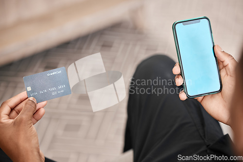 Image of Hands, phone and credit card for online shopping with green screen for advertising or marketing. Blue screen, mobile and black man on 5g smartphone for payment, investment or internet banking mock up