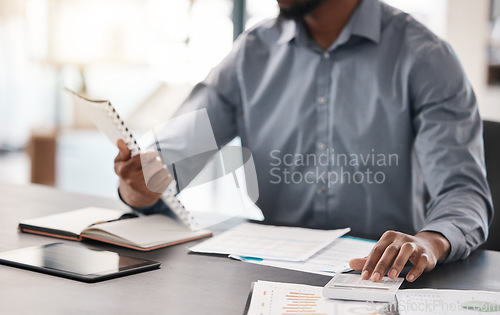 Image of Calculator, finance and documents with a business man accounting at a desk in his office at work. Budget, financial and investment with a male accounting working on savings or well management
