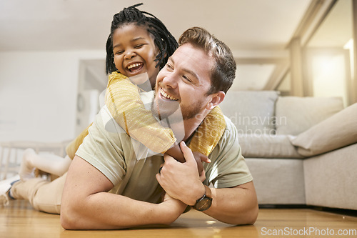 Image of Family, children and fun with a foster father and girl having fun together on the living room floor of their home together. Love, smile and happy with a man and adopted daughter bonding in a house