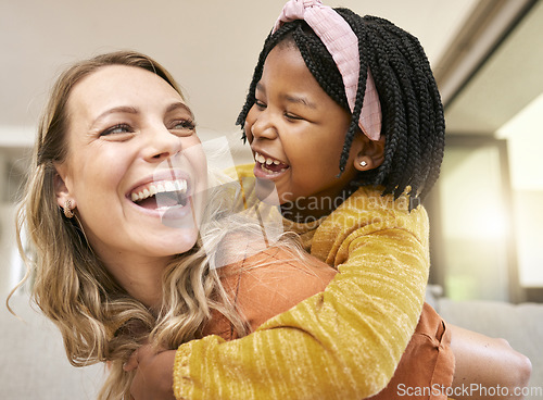 Image of Piggyback, bonding and mother and child in foster care on mothers day with love, smile and support. Family, interracial and African girl with a playful hug for her mom after adoption in their home