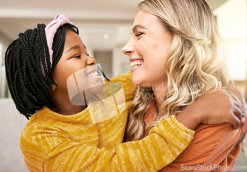 Image of Mother, adopted and daughter bonding or hugging with love, care and affection for childhood embrace. Diverse woman and foster little girl hugging and having fun while in the family home