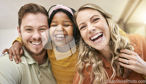 Image of Family, happiness and love with a portrait for care, support and quality time after adoption with mother, father and foster child together in their home. Face, smile and trust of man, woman and girl