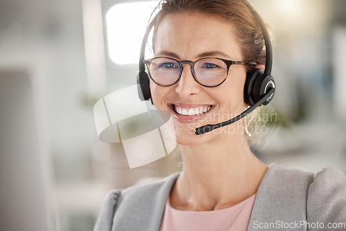 Image of Business woman in call center, happy customer service support agent in office or working online in Berlin. Professional telemarketing consultant, help desk job or contact us for crm communication