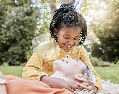 Image of Family, adoption and park with a mother and daughter having fun while bonding during summer. Nature, love and diversity with a foster parent woman and girl child outdoor together with a smile