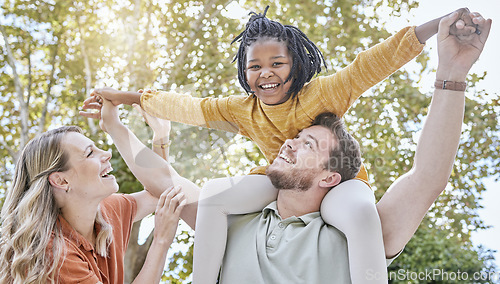 Image of Family, adoption and piggyback in the park with a girl and foster parents having fun together in the park. Diversity, playful and freedom with a mother, father and daughter bonding outdoor in nature
