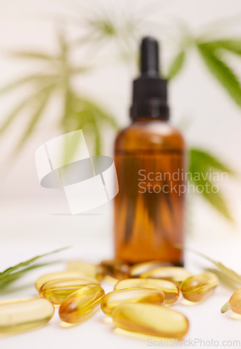 Image of Cannabis, oil and marijuana healthcare pills for legal stress plant or anxiety medicine. Cbd hemp product, luxury 420 medical wellness and natural medical weed for relax health in leaf background