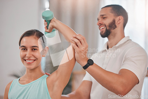 Image of Health, physiotherapy and wellness exercise rehabilitation with happy woman client lifting dumbbell. Workout, healthcare and physiotherapist helping girl with arm stretching and recovery fitness.