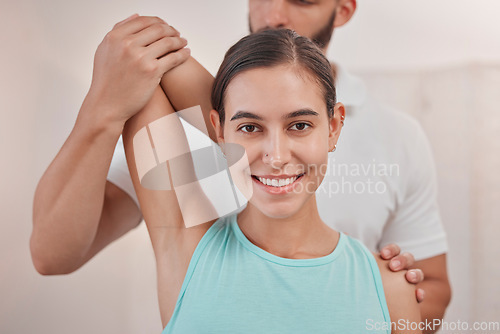 Image of Physical therapy, woman and physiotherapy of a chiropractor helping with an arm stretch. Portrait of a happy patient in a medical, doctor and spine assessment consultation with a smile about health