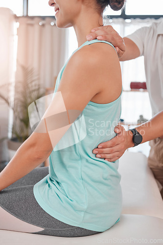 Image of Chiropractor, physiotherapy and back pain of woman while at physiotherapist for a massage, physical therapy and healing. Therapist with client at health and wellness chiropractic spa for consultation