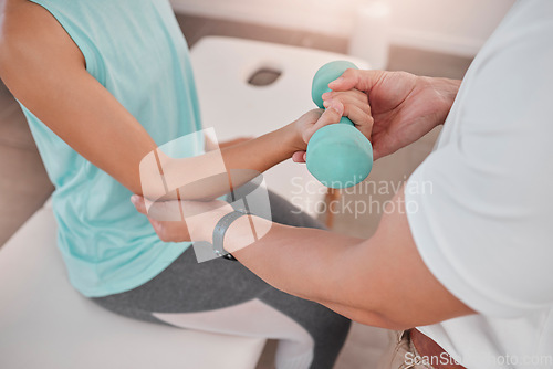 Image of Physical therapy, dumbbell and physiotherapist help patient in exam room for muscle, body or healthcare rehabilitation. Physiotherapy, helping and support doctor or fitness expert for sport injury