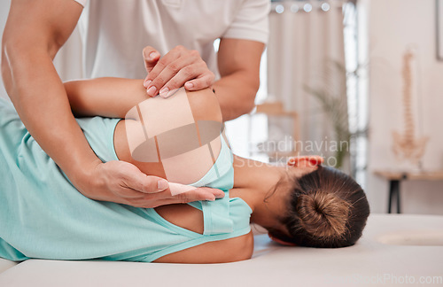 Image of Doctor, chiropractor and woman with back pain for physiotherapy from a physiotherapist helping with spine alignment. Rehabilitation and chiropractic worker healing a healthy girls spinal posture