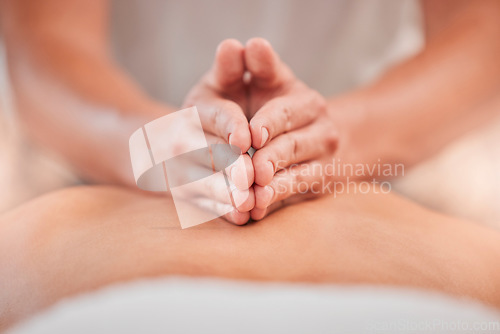 Image of Back massage, hand and spa for a massage therapist for zen body care and beauty, health or wellness. Massueuse, physical therapy and stress relief with tranquil treatment for relaxation and wellbeing