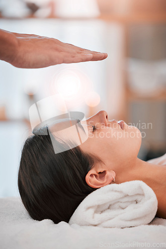Image of spa, woman and hands with light energy healing for luxury healthcare wellness or reiki peace. Relax, zen meditation therapy and spiritual peace with cosmetic expert person for palm focus chakra