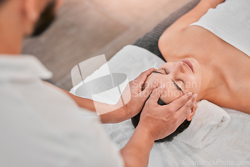 Image of Spa, face massage and masseuse in a beauty spa with a relaxed woman and massage therapy. Beauty, health and wellness with head massage for stress relief, peace and tranquil treatment