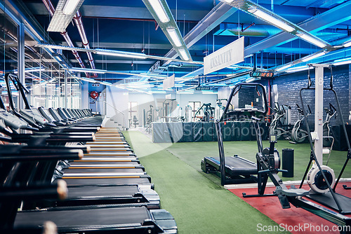 Image of Empty gym, equipment and studio for fitness, exercise and sports or wellness training indoors. Treadmill, machines and health center for workout, athletics and motivation for race or marathon