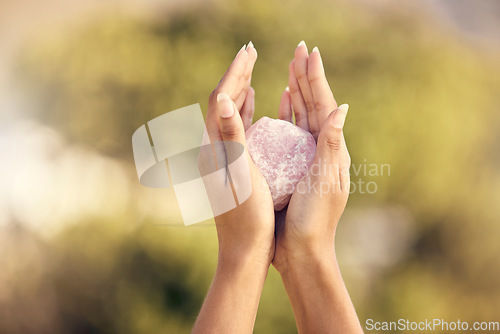 Image of Woman, hands and rose quartz in nature for meditation or occult practice. Crystal, yoga stone or rock for relax, mindfulness and zen healing, spiritual growth and female spirit, chakra or awakening.