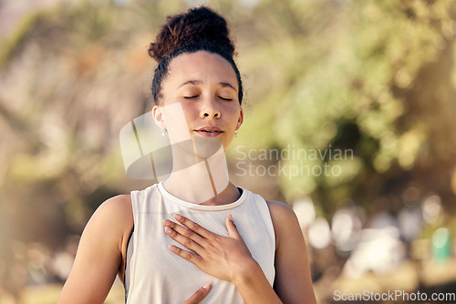 Image of Yoga, meditation and fitness with a black woman breathing for calm exercise outdoor in a nature park. Wellness, health and meditate with a female yogi finding peace, balance or zen alone outside