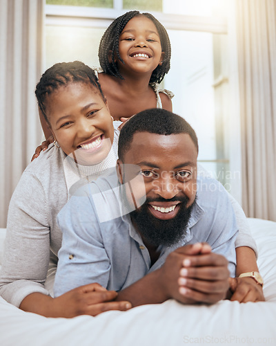 Image of Love, black family and with girl on bed, happy or smile together for bonding, loving and fun. Portrait, mother and father or parents with daughter in bedroom, quality time and happiness on break