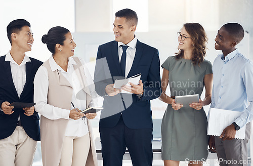 Image of Leadership, teamwork and group of business people in office for workshop with tablet and books. Diversity, collaboration and happy employees in workplace having discussion, talking or conversation.