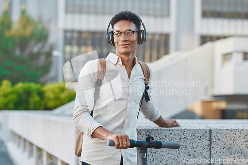Image of Black man, headphones and outdoor with scooter, in city and smile being casual, trendy and glasses. Gen z, travel and content to relax, happy or ready to commute being calm, happiness or eco friendly